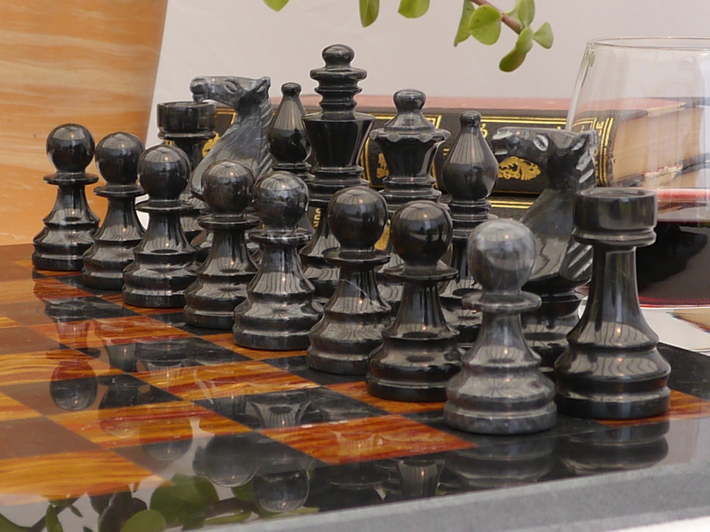 Luxury black leather and marble chess set board with roman chessmen –