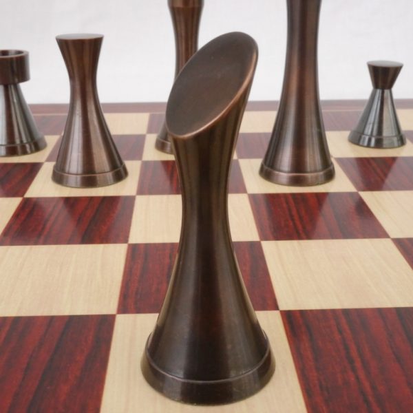 Premium Photo  Smiling little boy joying playing chess on wooden